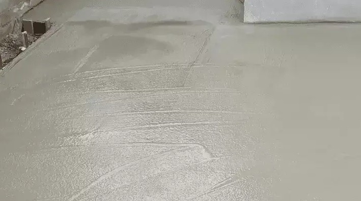 Freshly trowelled concrete slab surface