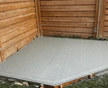 Concrete slab poured inside a timber walled shed