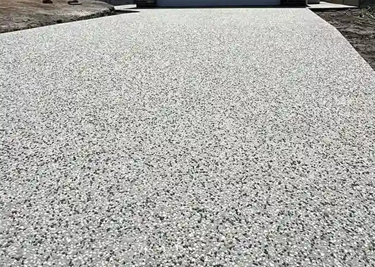 Exposed aggregate concrete surface in full sun